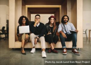 four people on a couch